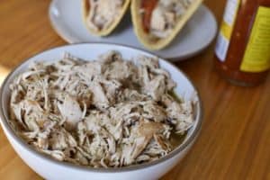 A bowl of shredded chicken carnitas